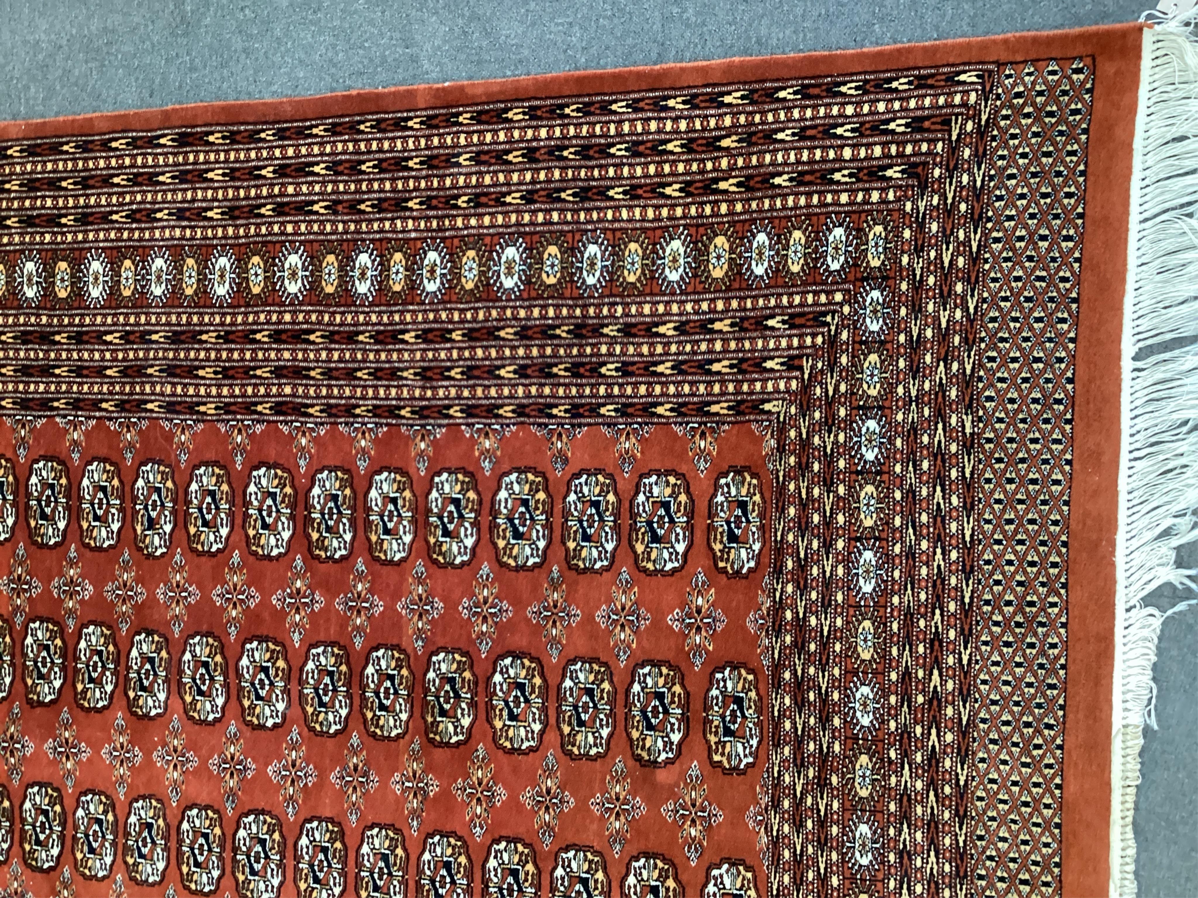 A Bokhara red ground carpet, 410 x 310cm. Condition - good